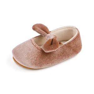 Close-up detail of soft pink velvet baby dress shoe with decorative bow for 0-1 year old