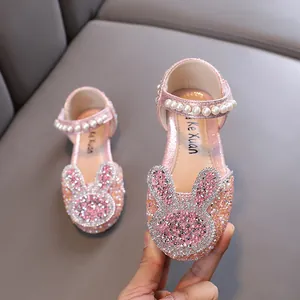 Sparkly pink girls princess flats featuring rhinestone rabbit and pearl strap detail
