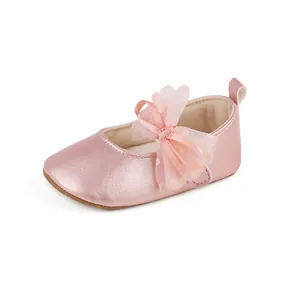 Detailed view of the delicate pink tulle bow on metallic baby princess walker shoes