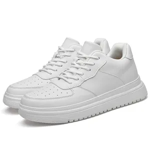 Classic all-white platform sneakers with perforated toe box and lace-up closure detail