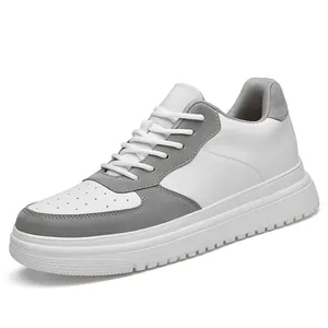 Close-up detail of white and grey mixed material outdoor sneakers with textured sole