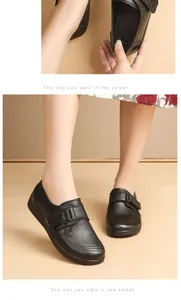 Close-up detail of black genuine leather maternal loafers for middle-aged women's comfort