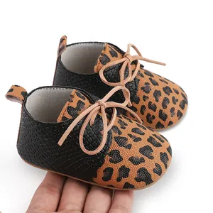 Detailed view of leopard print baby walking shoes featuring soft anti-slip rubber soles