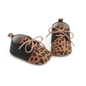 Detailed view of leopard print baby pre-walker shoes with non-slip rubber soles