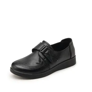 Comfortable black leather slip-on shoes for women with soft sole and hook-and-loop strap