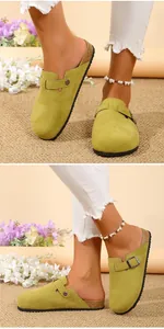 Close-up of lime green suede-like clogs with adjustable metal buckle strap and cork sole