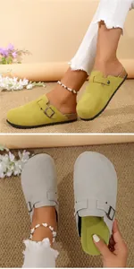 Detailed view of suede closed-toe clogs with adjustable buckle strap and cork sole