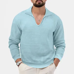 Detailed view of men's light blue waffle knit polo shirt with V-neck and lapel collar