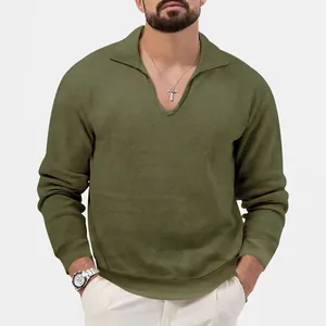 Detail view of a men's olive green waffle knit long-sleeved polo shirt with V-neck.
