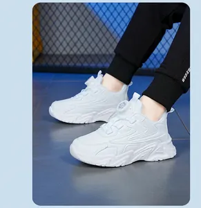 Detailed side view of white children sports shoes featuring a convenient rotary buckle.