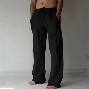 Vue détaillée du pantalon large en coton et lin noir pour hommes avec cordon