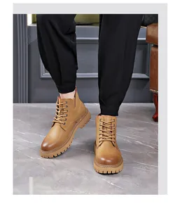 High-quality men's tan lace-up Martin boots with durable chunky lug sole worn by model