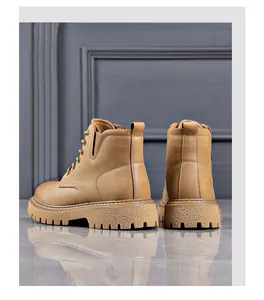 Rear view of classic tan work boots with durable textured lug soles and lace-up design