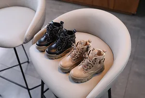Classic children's Martin boots in black and khaki colors with functional side zipper