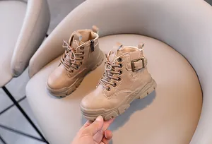 Detailed view of khaki children's Martin boots with side zipper and buckle detail