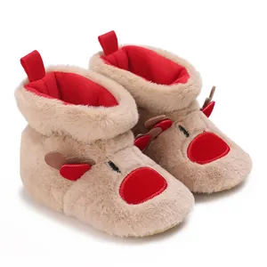 Cozy reindeer-themed baby boots featuring soft plush fabric and warm red fleece lining