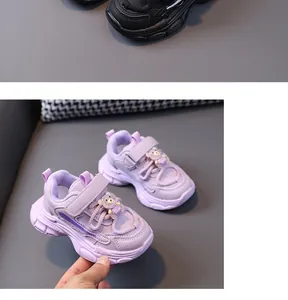 Lavender children's chunky sneaker detail featuring a cute bear charm and velcro strap