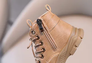 Close-up of children's brown Martin boot featuring a durable side zipper and laces.