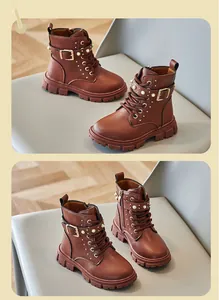 Detailed view of brown girls' British style Martin boots with pearls and buckles