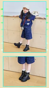 Close-up of black girls' British style Martin boots with pearl and buckle details
