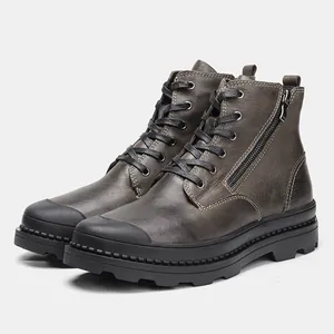 Detailed side view of premium leather men's work boots with durable black lug soles