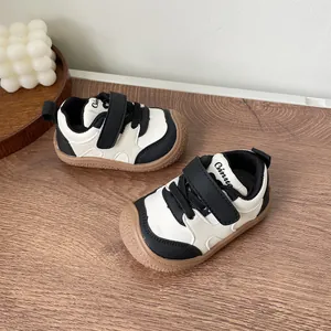 Detailed shot of black and white toddler walking shoes with comfortable soft soles