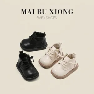 Stylish Korean-style baby walking boots in premium black and beige leather finish.