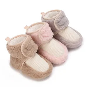 Three pairs of fleece-lined baby winter boots displayed in pink, khaki, and gray colors