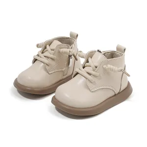 Comfortable cream leather toddler walking boots with side zipper and brown rubber soles