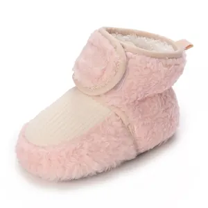 Warm and soft pink plush baby winter booties with velcro strap for newborns and infants