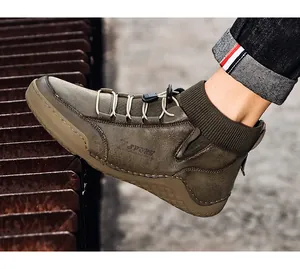 Close-up of men's leather Martin boots with knitted sock mouth and elastic laces