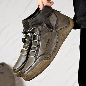 Detailed view of men's British style leather outdoor boots with elastic sock collar