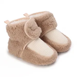 Close-up view of cozy infant fleece winter boots with non-slip soft soles and hook loop