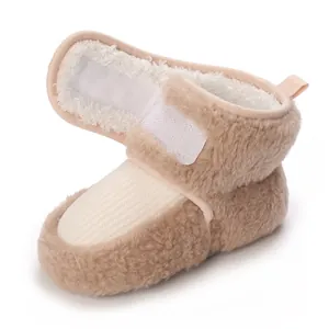 Detail view of baby winter fleece boots with soft sole and velcro strap for infants