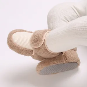 Close-up of cozy plush baby winter boots with soft anti-slip soles for toddlers.