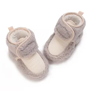 Detailed view of plush fleece-lined baby winter booties with soft soles and velcro straps.