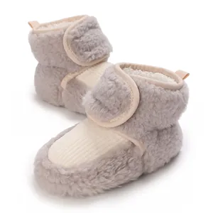 Soft fleece-lined baby winter booties with hook-and-loop closure detail for warmth