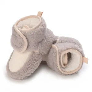Detailed view of cozy grey fleece baby winter boots featuring warm lining and soft soles