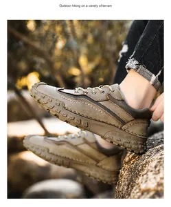 Détail des coutures artisanales sur chaussures de randonnée marron pour hommes