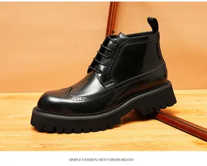 Detailed close-up of classic polished black men's brogue boots with thick lug soles.