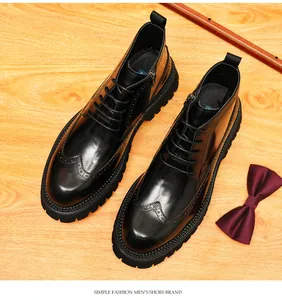 Detailed view of men's black glossy leather brogue boots with wingtip design and chunky sole