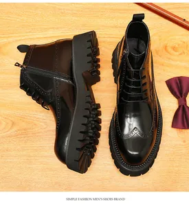 Detailed view of men's black leather brogue boots with thick lug soles