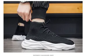 Side view of men's breathable high-top black sock sneakers with chunky white platform soles.
