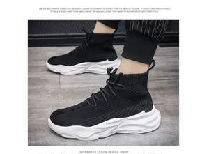 Detail view of stylish black high-top breathable sock sneakers for men with platform soles