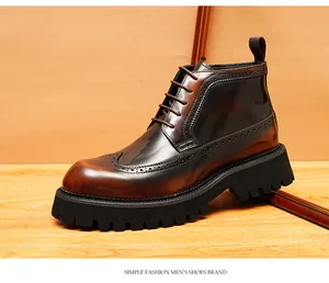 Detailed side view of men's brown leather wingtip brogue boots with thick lug sole