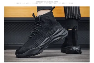 Detailed view of black breathable high-top sock sneakers for men with thick soles