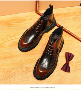 Close-up detail of glossy men's leather high-top brogue boots with side zipper and wingtip.