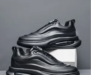 Side detail of black leather chunky sneakers with breathable perforation.
