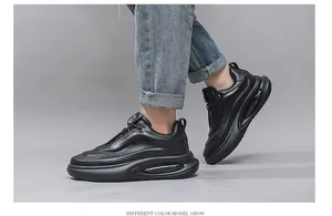 Side view of black leather chunky dad sneakers for men with breathable mesh panels