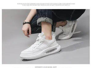 Gedetailleerd zijaanzicht van witte leren herensneakers met luchtkussenzool